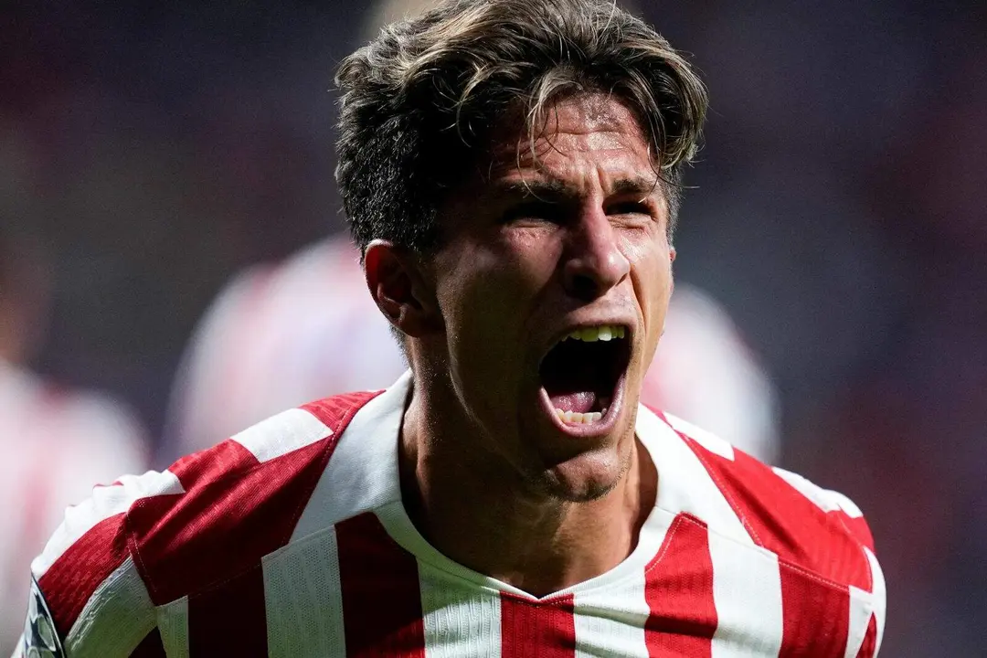 Giuliano celebrando un gol en Champions League